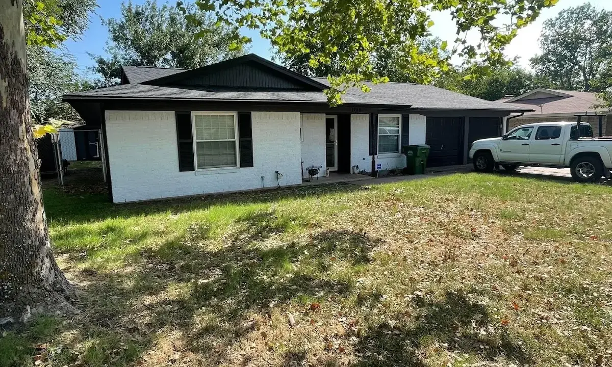 Professional roofing crew working on a residential roof in The Pinery